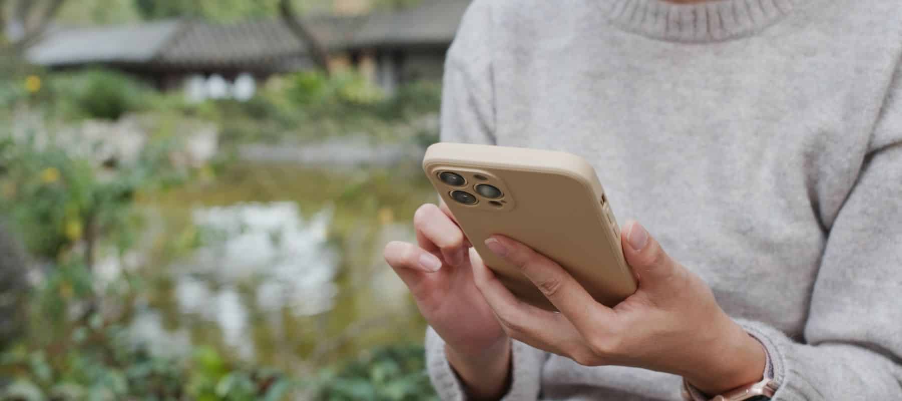 woman using her smart phone to make a payment