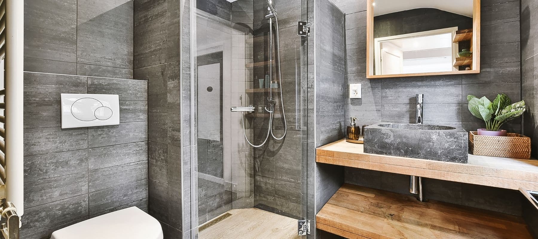 slate bathroom with wood fixtures