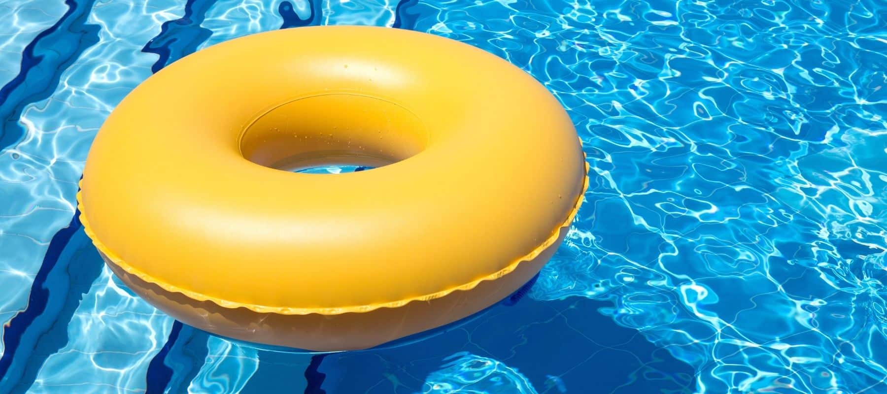 yellow inner-tube floating in a pool